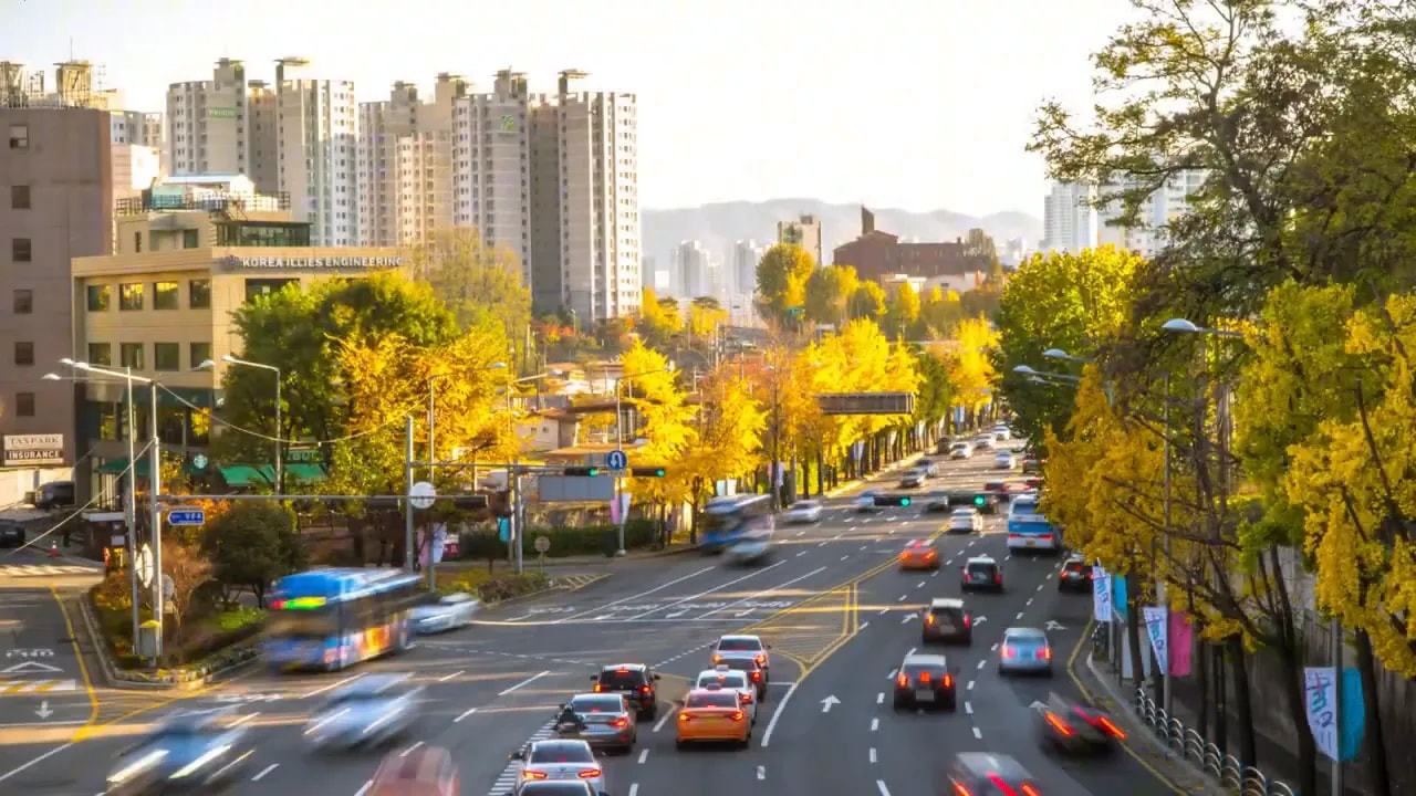 Busy multilane city street with cars and buildings