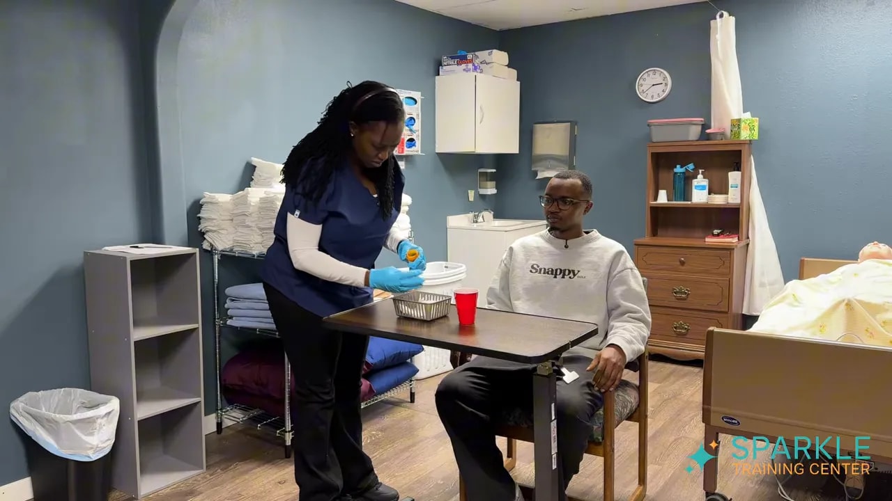 caregiver handling medication container over the table with red cup of water beside it
