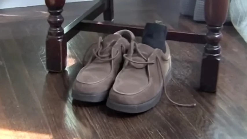 Pair of lightweight low-cut shoes on a wood floor