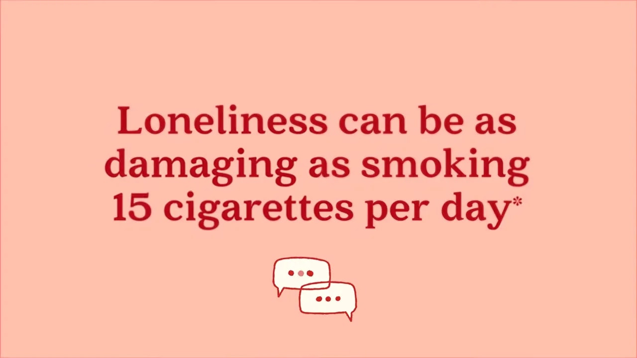 Text slide stating loneliness can be as damaging as smoking 15 cigarettes per day